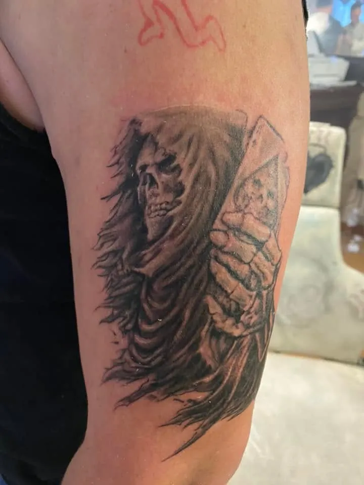 Grim reaper holding a death card, upper arm, black & gray